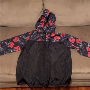 Roses and black windbreaker
